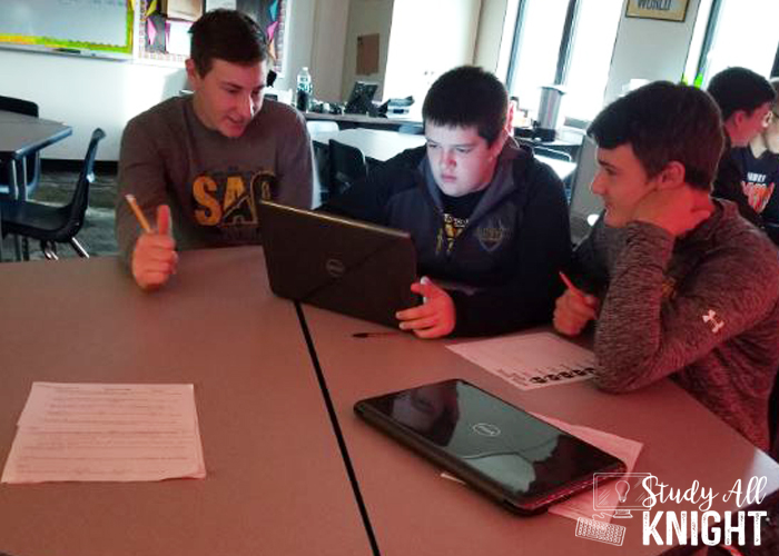 Three male students working in collaborative groups